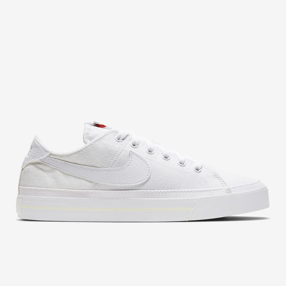 Nike white hotsell canvas sneakers womens